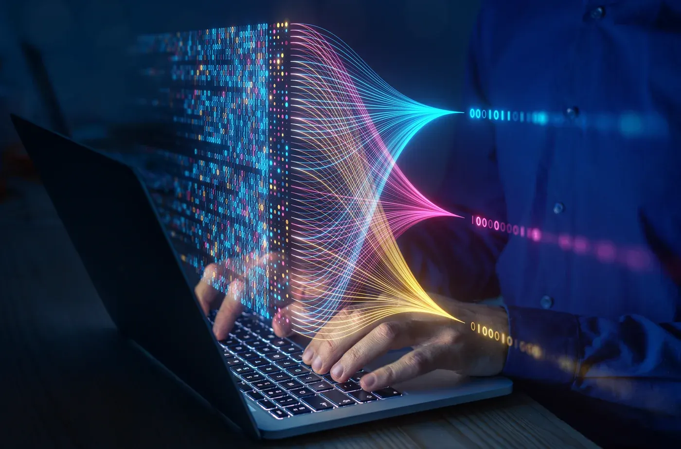 Hands typing on laptop with digital data streams and binary code visualization emanating from screen